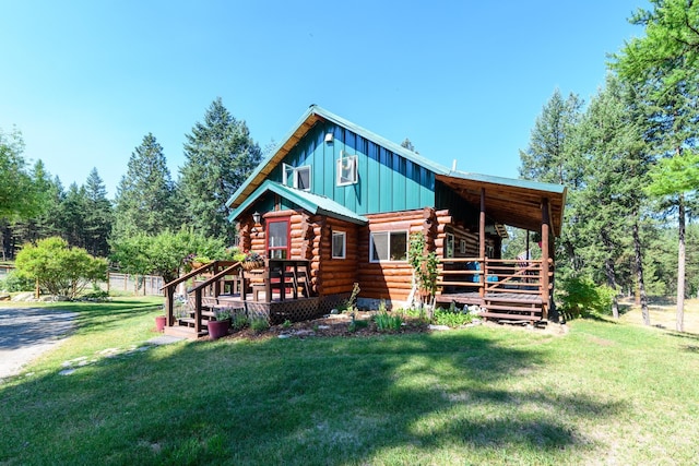 5899 Black Lake Rd, Rexford, MT 59930 - back of property with a yard, board and batten siding, log exterior, and a deck