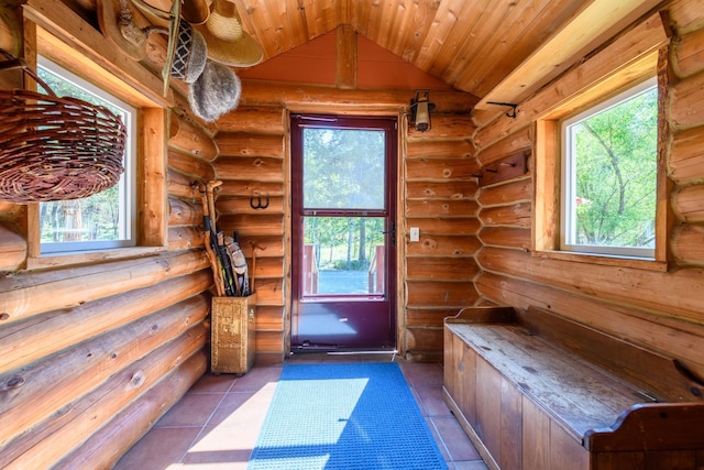5899 Black Lake Rd, Rexford, MT 59930 - mudroom featuring wood ceiling, dark tile patterned floors, vaulted ceiling, and rustic walls