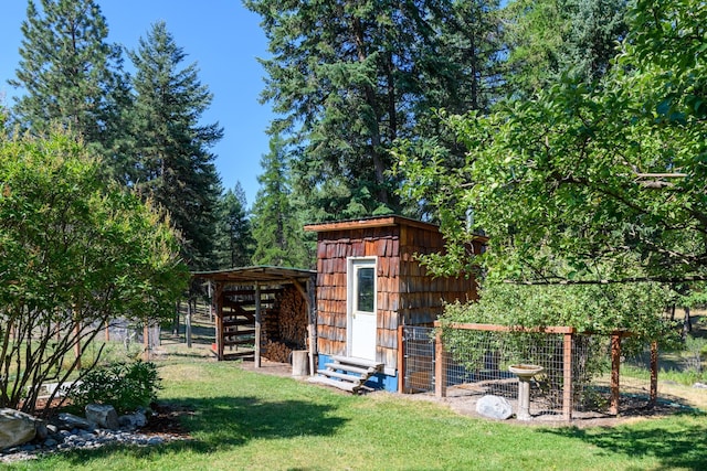 view of outdoor structure with a yard