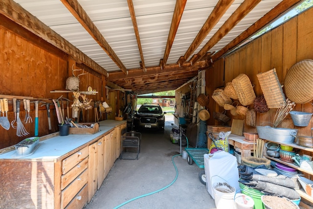 garage featuring wooden walls