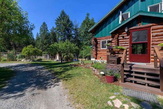 5899 Black Lake Rd, Rexford, MT 59930 - view of home's exterior featuring log siding and a yard