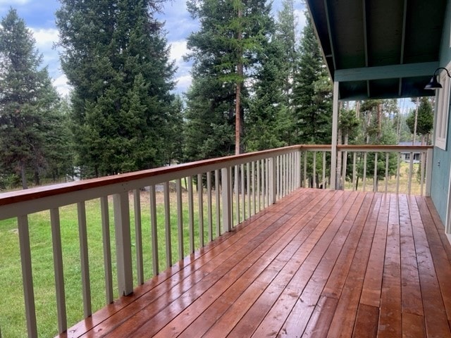 wooden deck with a yard