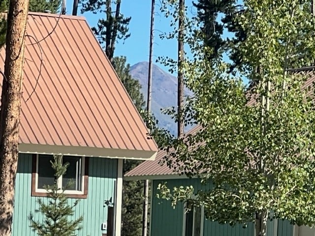 view of side of property with a mountain view