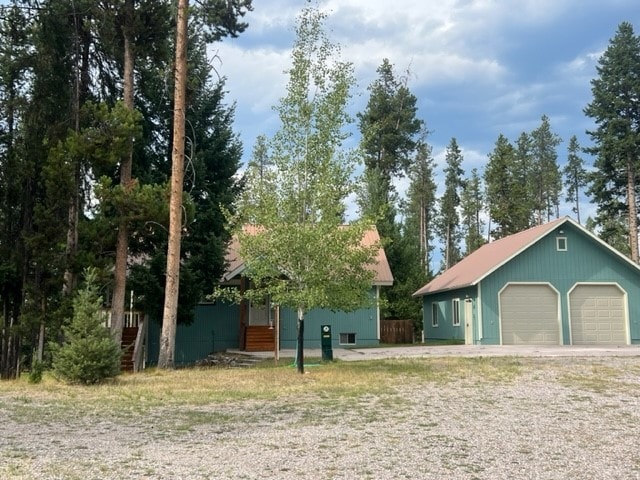 exterior space featuring an outbuilding and a garage