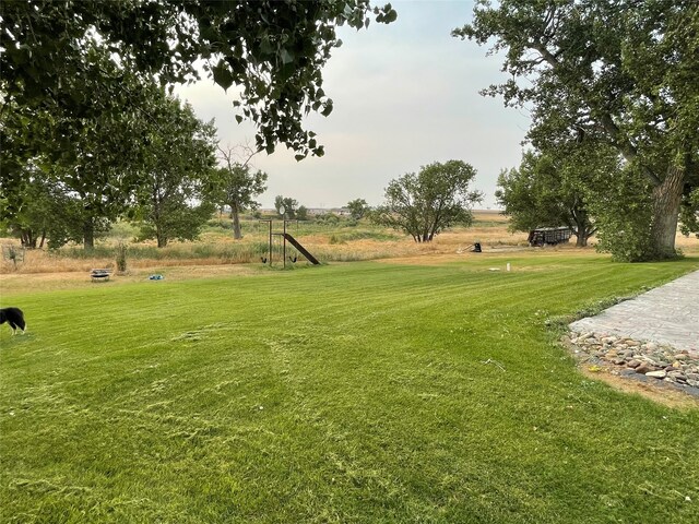 view of property's community featuring a yard