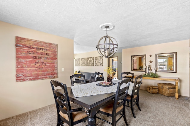 carpeted dining area featuring a chandelier and a textured ceiling