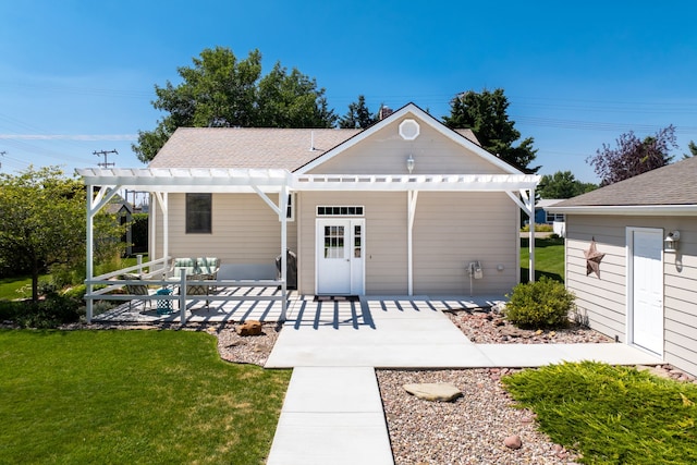 exterior space with a pergola and a lawn