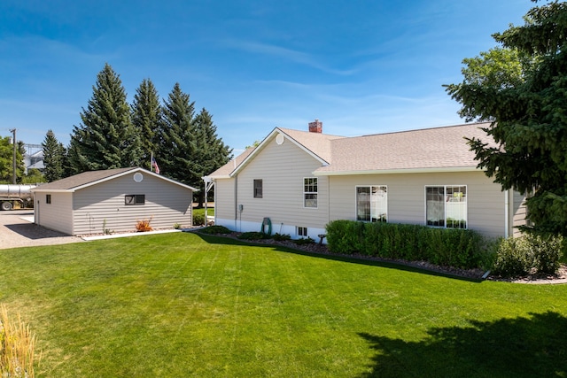 back of house featuring a yard