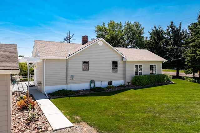 view of side of property featuring a yard