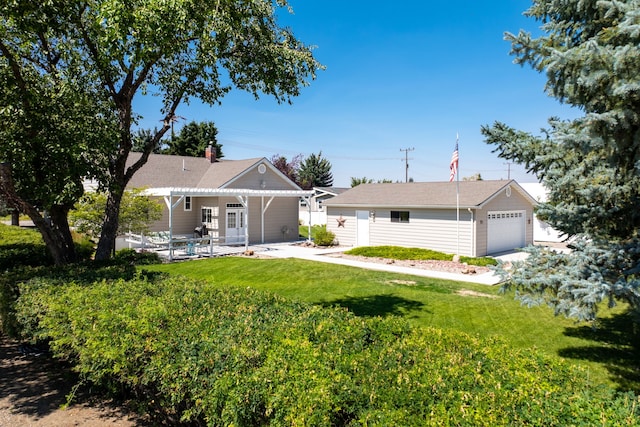 exterior space with a garage, a patio, and a front yard