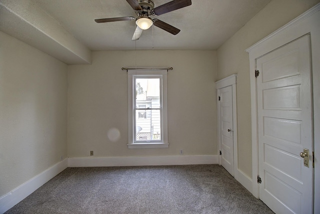 unfurnished room featuring carpet flooring and ceiling fan