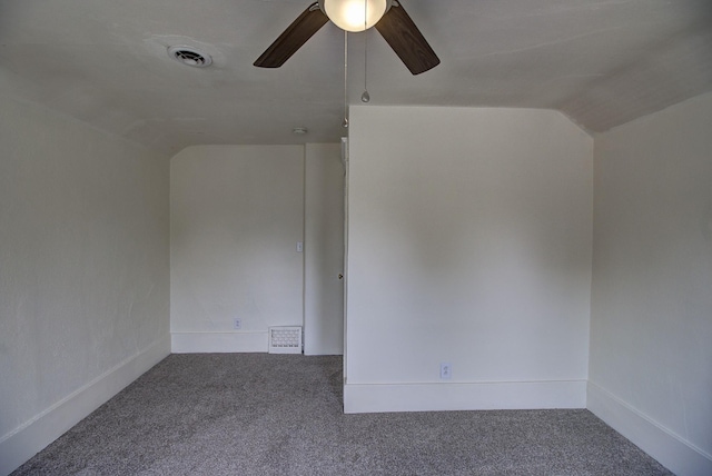 unfurnished room featuring ceiling fan, lofted ceiling, and carpet flooring