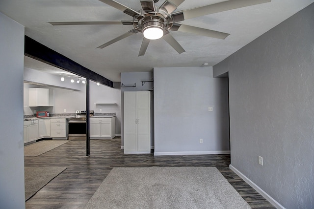 interior space featuring dark hardwood / wood-style floors and ceiling fan