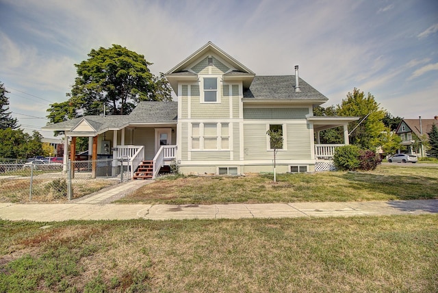 view of front of house featuring a front yard and covered porch