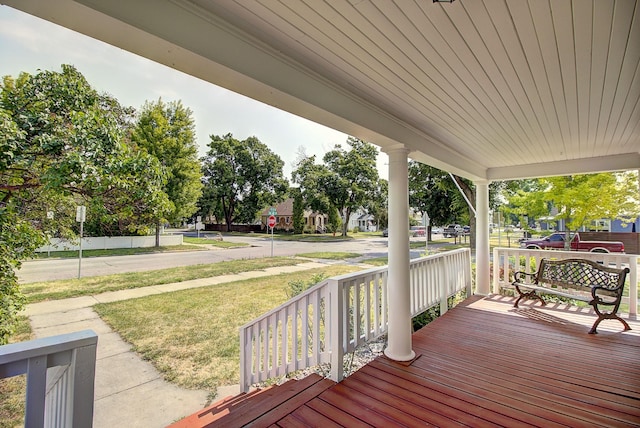 wooden terrace featuring covered porch