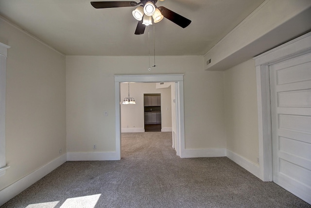 spare room featuring light carpet and ceiling fan