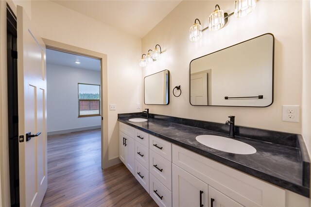 bathroom featuring vanity and hardwood / wood-style flooring