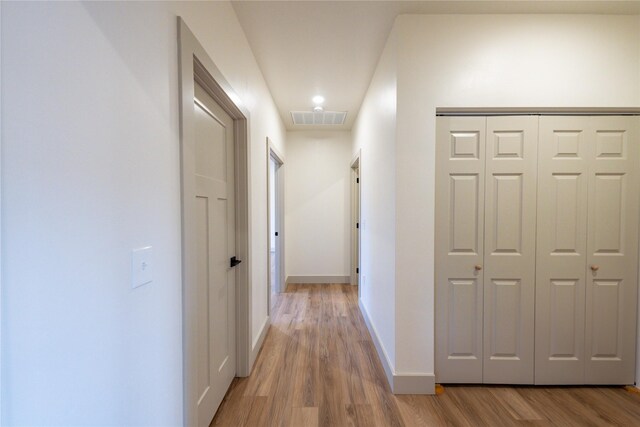 corridor featuring light hardwood / wood-style flooring