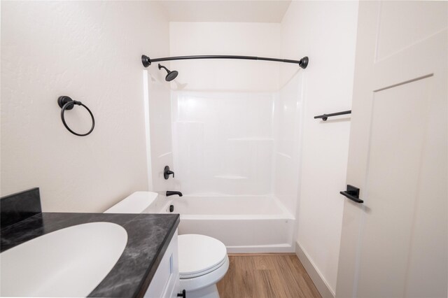 full bathroom featuring vanity, toilet, bathtub / shower combination, and wood-type flooring