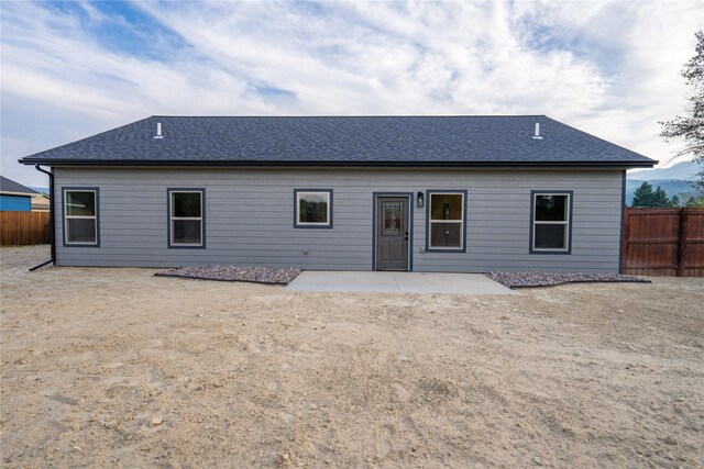 rear view of property featuring a patio