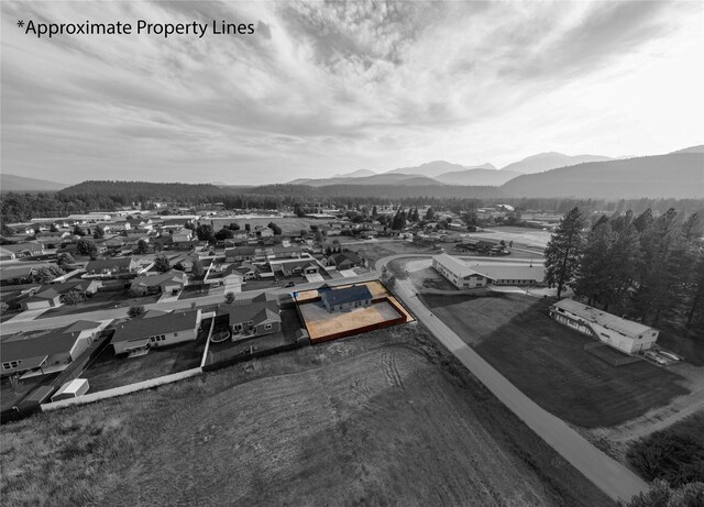 birds eye view of property featuring a mountain view