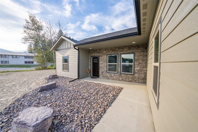 property entrance featuring a patio