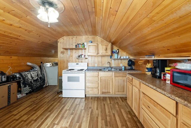 kitchen with electric range, vaulted ceiling, wood walls, and light brown cabinetry