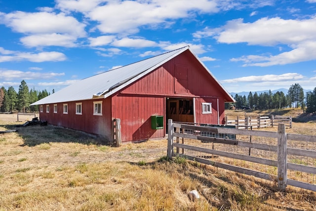 exterior space featuring an outbuilding and a rural view