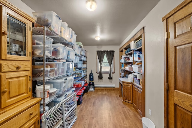 storage room with a baseboard radiator