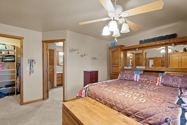 bedroom featuring ceiling fan, light colored carpet, and a closet