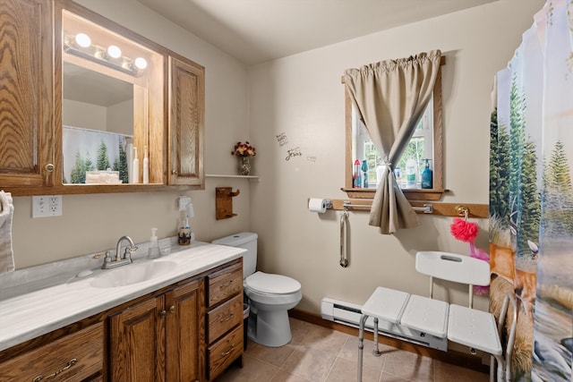 bathroom with vanity, tile patterned flooring, and toilet