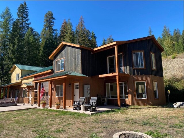 4 Lake Dr, Heron, MT 59844 - back of house with a patio, metal roof, and a yard