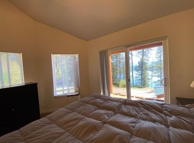 4 Lake Dr, Heron, MT 59844 - bedroom featuring access to outside, multiple windows, and lofted ceiling