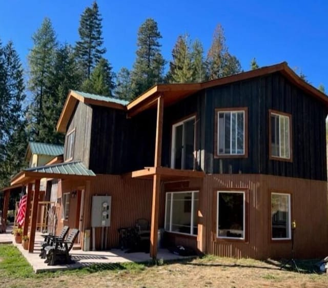 4 Lake Dr, Heron, MT 59844 - view of home's exterior featuring a patio area and metal roof