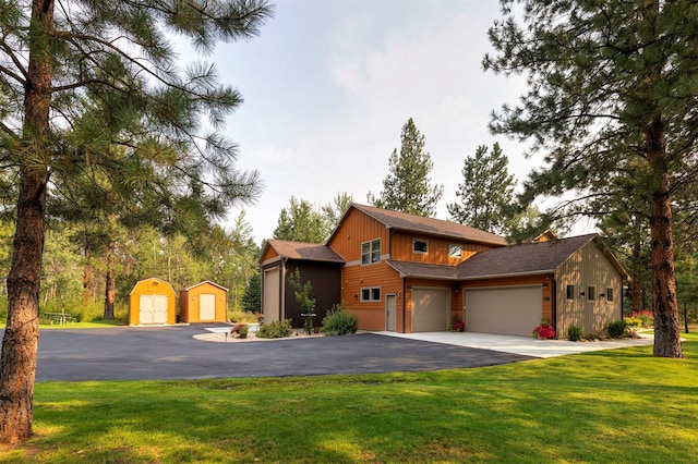 view of front facade with a front yard and a garage