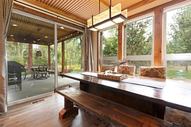 unfurnished sunroom featuring wood ceiling