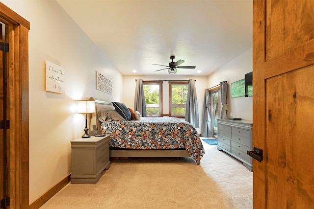 bedroom featuring ceiling fan and light carpet