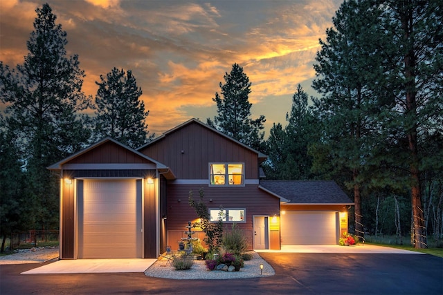 view of front of property featuring a garage, board and batten siding, and concrete driveway