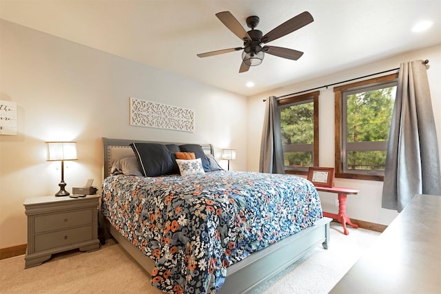 bedroom with a ceiling fan, recessed lighting, light colored carpet, and baseboards