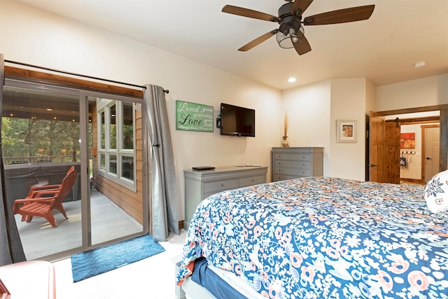 bedroom with access to outside, light colored carpet, a barn door, and ceiling fan