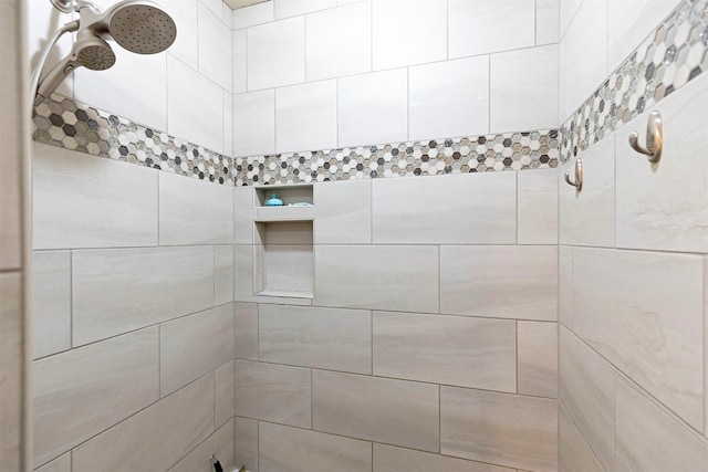 bathroom with a tile shower