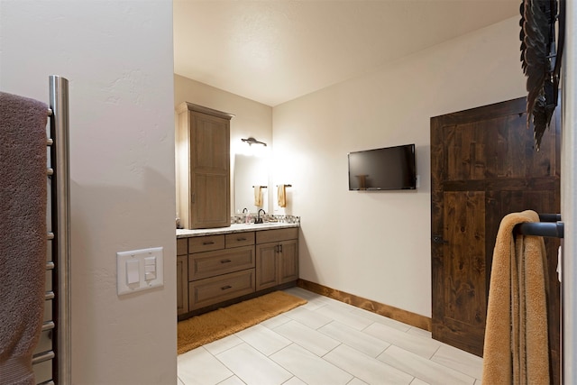 bathroom with tile patterned floors and vanity