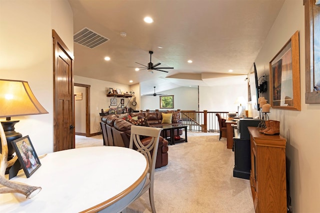 dining room featuring visible vents, light colored carpet, lofted ceiling, ceiling fan, and recessed lighting