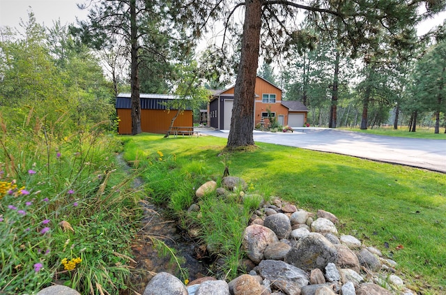 view of yard featuring a garage