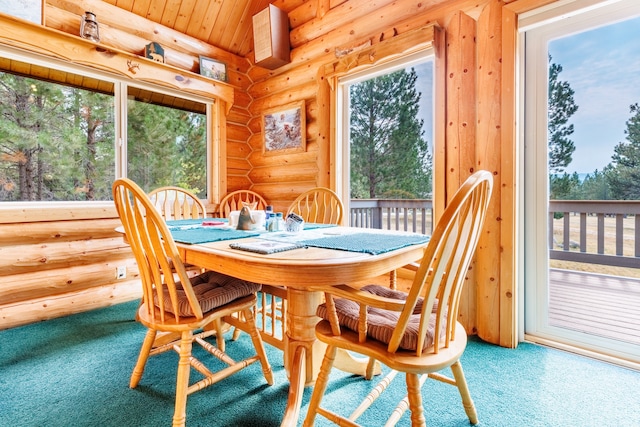 dining area with log walls and carpet