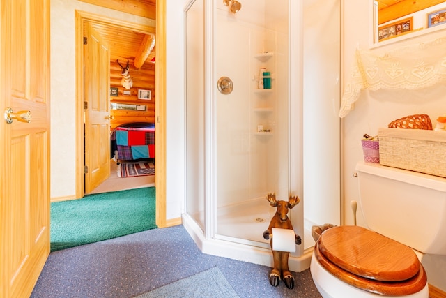 bathroom featuring a shower with shower door, wooden ceiling, log walls, and toilet