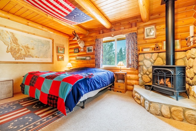 carpeted bedroom with log walls, a wood stove, beam ceiling, and wooden ceiling