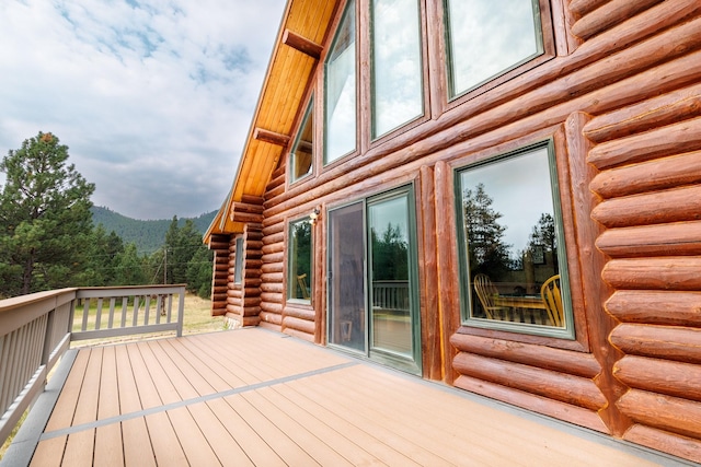 wooden terrace with a mountain view