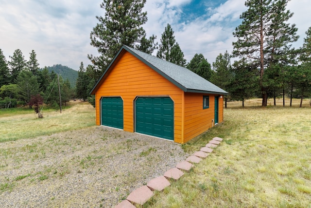 garage with a lawn