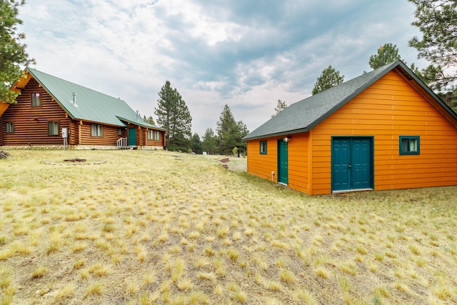 exterior space with an outbuilding
